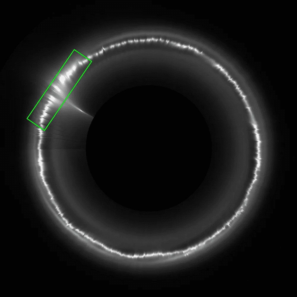 Cassini image Saturn rings glowing spot NASA